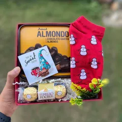 A sweet and simple Christmas treat. This hamper includes a tin of Amul chocolate-coated almonds, a pair of festive snowman socks, and Ferrero Rocher chocolates, making it an ideal stocking stuffer or Secret Santa gift.