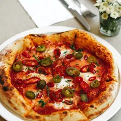 A classic spicy pizza with jalapeños and red chili on a San Marzano tomato base with fresh mozzarella. It's a perfect choice for those who like a little heat with their slice.