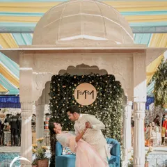 A joyful moment from a Rajasthani-themed Haldi. I created this setup with a marble-finish gazebo and a backdrop of greenery and lemons, providing a beautiful, picturesque spot for the couple's photos.