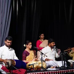 A glimpse into the soul of our performances, where music and dance become one. Here, you see our live orchestra, featuring talented vocalists, the melodic flute, and the rhythmic pulse of the mridangam, all coming together to create a truly divine experience on stage.