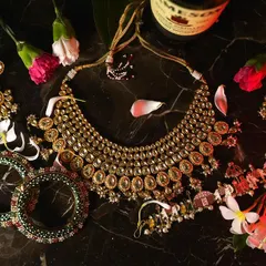 A flat lay of the stunning bridal jewelry set. We take care to photograph these important details, from the kundan necklace to the bangles, as they are a crucial part of the wedding story.