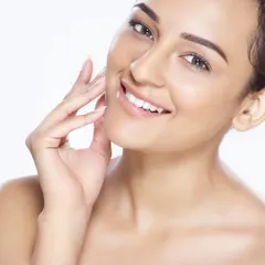 A bright, high-key beauty portrait that radiates joy and confidence. This style is ideal for campaigns that want to convey a sense of freshness, health, and natural glow.