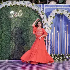 A young performer twirling in her beautiful red dress. I make sure the kids feel confident and happy during their performance.