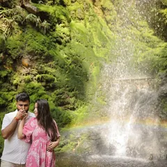 A little bit of magic happened during this waterfall shoot when a rainbow appeared. It was a perfect, unscripted moment that added a touch of wonder to their pre-wedding photography session.