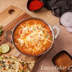 The Lawabdar Chicken is a rich and creamy main course. It's cooked in a flavourful gravy and topped with grated cheese, making it a truly indulgent dish.