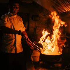 Fueled by fire, finished with finesse. A glimpse into our kitchen where the real magic happens, as our chef brings a dish to life with the dramatic flare of a wok. This is the passion and energy we bring to every event.