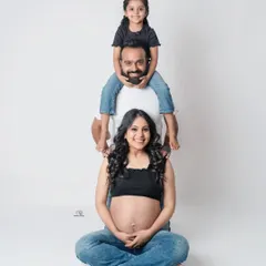 Let's have some fun. This playful "family totem pole" pose is a great way to get genuine smiles and create a memory that shows your family's fun-loving spirit.