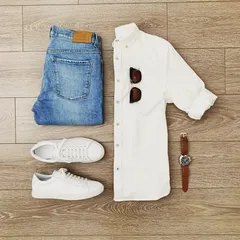 A classic date night option for men. A crisp white button-down shirt, well-fitting jeans, and clean white sneakers is a look that is timeless, confident, and effortlessly cool.