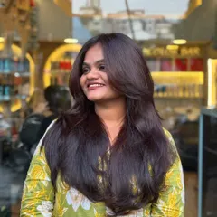 A happy client showing off her new soft layers. This haircut is perfect for adding volume and making the hair feel lighter and more dynamic.