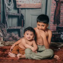 The playful side of brotherhood, with giggles and sweet expressions during this fun sibling photoshoot.