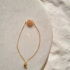 Another view of my initial embossed Peach Moonstone bracelet.