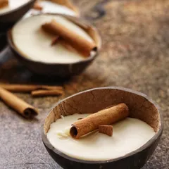 A set of my Cinnamon Coconut candles, ready for gifting. This is more than just a candle; it's the comfort of chai and the warmth of memories.