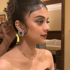 Getting this gorgeous girl ready for her brother's reception. I created a sophisticated smokey eye and paired it with a chic messy updo to complement her elegant black dress.