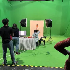 This behind-the-scenes shot captures a milestone moment: my first test look shoot for the Netflix series 'Kaala Paani'. Working on a professional green screen set with a full crew demonstrates my capability to handle large-scale productions for major industry players.