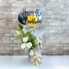 Reaching 40 is a milestone worth celebrating with style. This hamper features a personalized "Happy 40th Birthday" balloon, a fresh arrangement of white roses and lilies, and a selection of curated treats, making it a sophisticated and heartfelt gift.