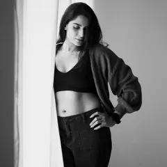 Another shot from the same series, showing a different pose. The monochrome treatment enhances the feeling of drama and intimacy.