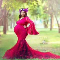 Choosing a gown is a key part of the styling process. This stunning red lace dress with its long tulle train makes a powerful statement and photographs beautifully outdoors.