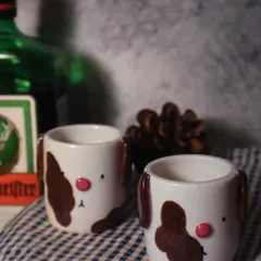 A pair of dog-faced shot glasses, because why not? These are from my Paw-try collection and are always a conversation starter.
