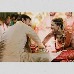The playful interaction between Nihal and Sravanthi during their wedding rituals, a genuine smile that tells a story of their connection.