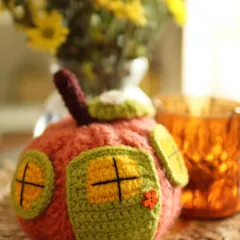 A close-up of my whimsical Pumpkin House. With its little green door and windowed walls, it's a magical piece of autumn decor that sparks the imagination.