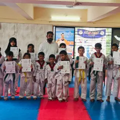 A group of our students proudly displaying their new certificates after a successful belt promotion. It's a testament to their dedication.