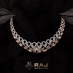 This elegant necklace features a graceful design of looping hearts set with sparkling CZ stones, culminating in a central dark gemstone. It is a beautiful expression of modern romance and sophisticated style.