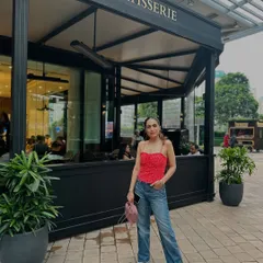 A pop of color for a day out. I styled this red corset-style top with classic blue jeans and white sneakers for a casual yet eye-catching look.