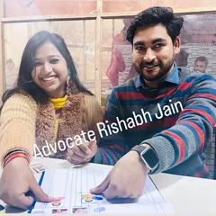 A smiling couple points to their details on the marriage register, a happy conclusion to their legal formalities. I assist with love marriages and provide all necessary legal services in Delhi.