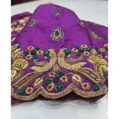 A detailed close-up of the peacock motif on the sleeve cuff. Notice the intricate zardosi work that gives the peacock its form and the colorful floral accents surrounding it.