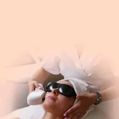 Here is a patient undergoing a laser hair reduction session. The procedure is comfortable, with the patient wearing protective eyewear as the laser handpiece is applied to the treatment area.