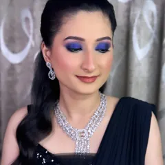 A detailed shot of the electric blue smokey eye. The vibrant color is blended seamlessly to create a dramatic yet sophisticated look for an evening party.