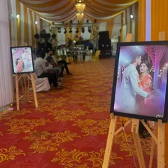 A closer look at the personalized photo displays we use to decorate the entrance. These framed pictures on easels are a wonderful way to share the couple's journey with their guests.