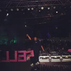 On stage at a music festival, in front of a massive crowd. I have the experience to handle large scale events and deliver a mainstage worthy performance.