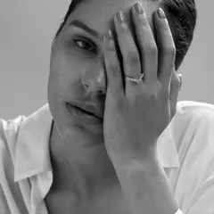 In this shot, the hand partially covering the face adds a layer of mystery and vulnerability. It’s a simple gesture that tells a complex story, perfect for fine art portraiture.