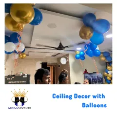 Ceiling decor with balloons can completely transform a living room. The floating bunches add color and dimension, making the space feel ready for a party without taking up any floor space.