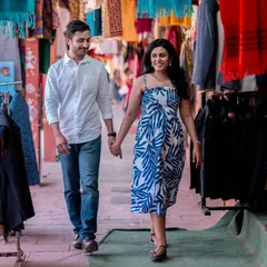 Exploring the colorful lanes of a local market. This candid shot captures the joy of discovery and the feeling of being on an adventure together.