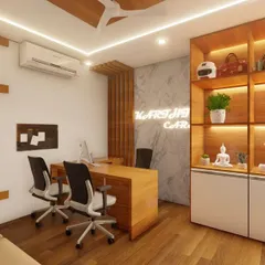 A modern office interior for Karthik Cars in Mysore. The design features a mix of wood, a marble-finish accent wall with a neon logo, and functional display shelving.