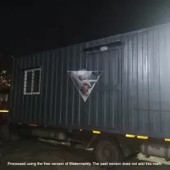 Another view of a portable office loaded onto a truck, ready to be delivered to a client's site. These cabins are built to be moved, offering complete flexibility for businesses with changing locations.