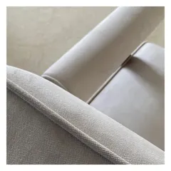 The piping on an armchair is a small detail that makes a big impact. This macro shot highlights the quality of the fabric and the precision of the upholstery, showcasing our commitment to craftsmanship.