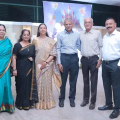 A group portrait of the grandparents and extended family at a birthday celebration. These are the photos that become family history.