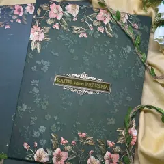 This dark green invitation with contrasting pink and white floral illustrations offers a modern yet timeless take on the floral theme.