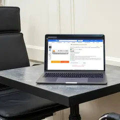 Another view of the laptop with a different product image on the screen, showcasing variations for A+ content on e-commerce sites.