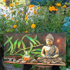I find so much peace in painting Buddha, and this piece is special. I used a metallic finish that glows beautifully in candlelight, set against a backdrop of my own terrace garden flowers. It’s a piece of tranquility for your space.