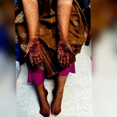 A full view of a bride's hands and feet, showcasing the rich, even stain achieved with my organic henna. It's so satisfying to see the complete look.