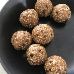 A close-up of the Luteal Phase seed balls, made with sesame and sunflower seeds to support progesterone and ease PMS symptoms.