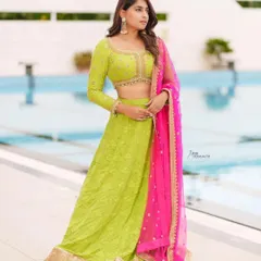 Actress Nishvika Naidu wears our vibrant lime green and pink lehenga for the 'Dance Karnataka Dance' show. This colorful and festive outfit is available for you to rent.