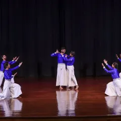 A scene depicting a narrative moment between two lead dancers, surrounded by the supporting cast. We use dance to tell stories that can align with your company's themes or event narrative.