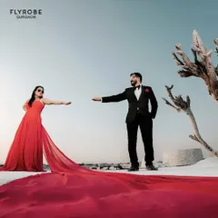 Make your pre-wedding shoot truly epic with a dramatic trail gown. This vibrant red gown flows beautifully on camera, creating breathtaking shots that you will cherish forever. It’s a showstopper, available for rent.