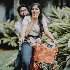 A playful and funny pose with a couple and a decorated bicycle, perfect for a lighthearted and casual pre-wedding shoot.