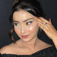 A side profile highlighting the sharp, colorful winged liner in this creative look.